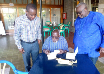 At The United Kenyan Club, Prof Taban Lo Liyong enjoys signing copies of his book After Troy to his guests