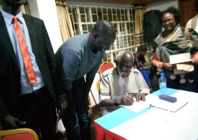 Prof Taban Lo Liyong signs books at the launch of After Troy