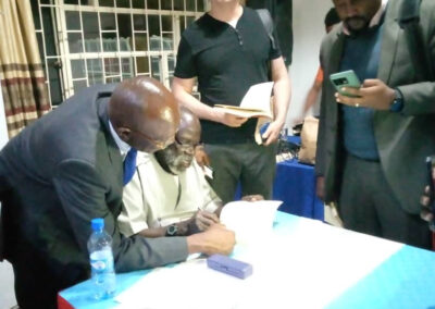 Prof. Taban Lo Liyong signs books at the After Troy book launch