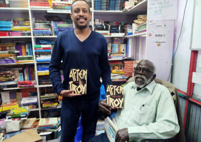 Prof. Taban Lo Liyong with Bulle Adullahi of Nuria Bookshop proudly displaying After Troy book